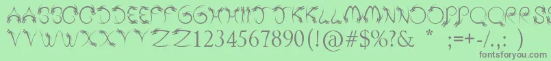 フォントTribalDragon – 緑の背景に灰色の文字