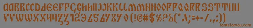 フォントPiperPieCondensed – 茶色の文字が灰色の背景にあります。