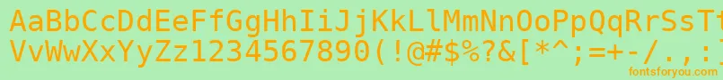 フォントVeramono – オレンジの文字が緑の背景にあります。