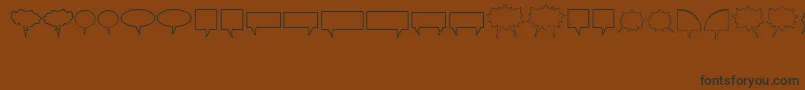 Komikabb Font – Black Fonts on Brown Background