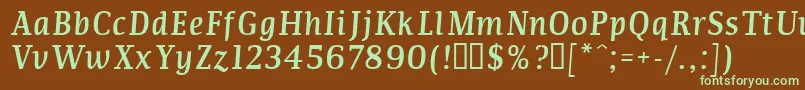 フォントCommi – 緑色の文字が茶色の背景にあります。