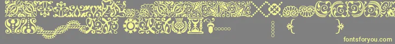 Шрифт AdobeCaslonOrnaments – жёлтые шрифты на сером фоне