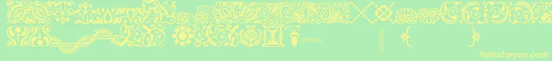 Шрифт AdobeCaslonOrnaments – жёлтые шрифты на зелёном фоне