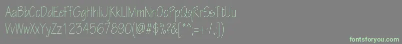 フォントEskiztwolightcondc – 灰色の背景に緑のフォント