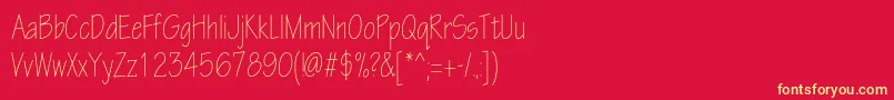 Шрифт Eskiztwolightcondc – жёлтые шрифты на красном фоне