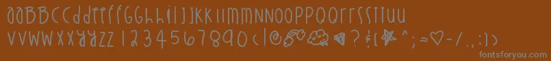 フォントStuntinonyou – 茶色の背景に灰色の文字