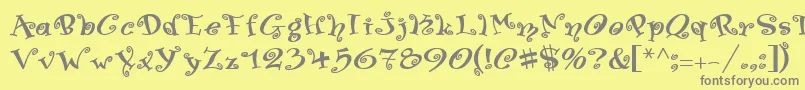 SwingerMedium-fontti – harmaat kirjasimet keltaisella taustalla