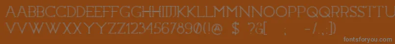 Constrocktion-fontti – harmaat kirjasimet ruskealla taustalla