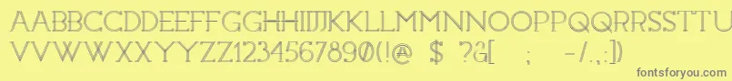 フォントConstrocktion – 黄色の背景に灰色の文字