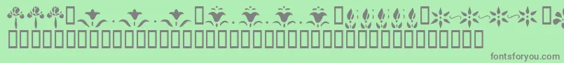 フォントKrFleurFlairLines – 緑の背景に灰色の文字