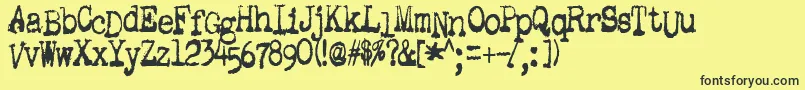 GutterVomit Font – Black Fonts on Yellow Background