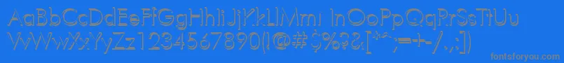 FuturisvolumecYrillic-fontti – harmaat kirjasimet sinisellä taustalla