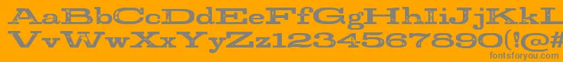 StudRegular-Schriftart – Graue Schriften auf orangefarbenem Hintergrund