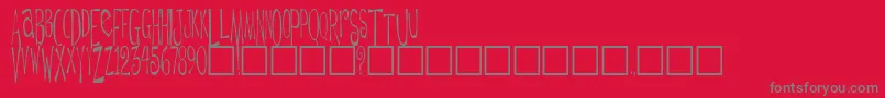 DaytripperPlain-Schriftart – Graue Schriften auf rotem Hintergrund