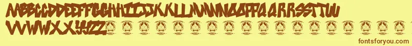 フォントSweetasrevenge – 茶色の文字が黄色の背景にあります。
