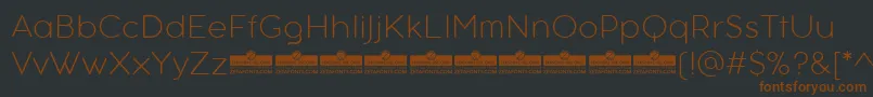 Шрифт AristotelicaTextExtralightTrial – коричневые шрифты на чёрном фоне