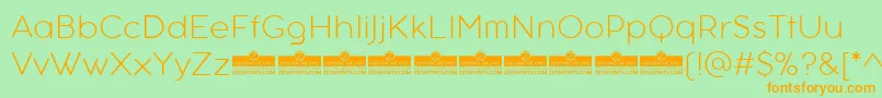 フォントAristotelicaTextExtralightTrial – オレンジの文字が緑の背景にあります。