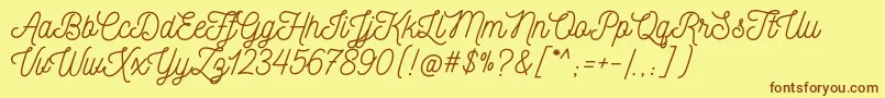 NickainleyNormal Font – Brown Fonts on Yellow Background