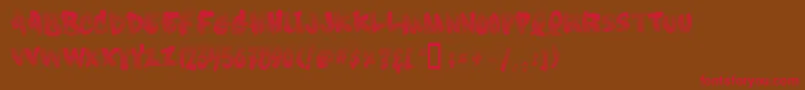 フォントSoft Sugar  Fade  – 赤い文字が茶色の背景にあります。