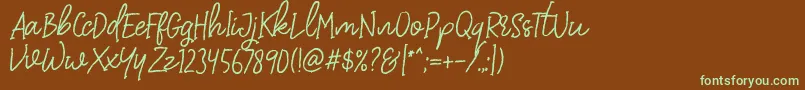 フォントDearDisyaStandard – 緑色の文字が茶色の背景にあります。