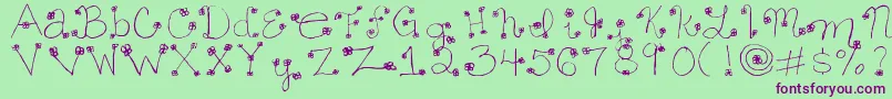 フォントDaisymae – 緑の背景に紫のフォント