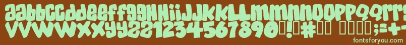 Skatd Font – Green Fonts on Brown Background