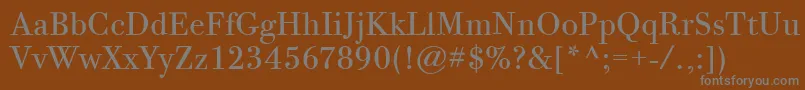 BodoniTwelveItcBook-fontti – harmaat kirjasimet ruskealla taustalla