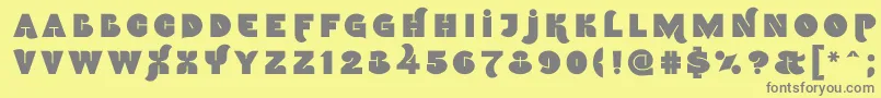 フォントNamskoutin – 黄色の背景に灰色の文字