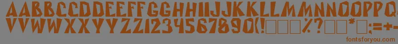 フォントRublik – 茶色の文字が灰色の背景にあります。