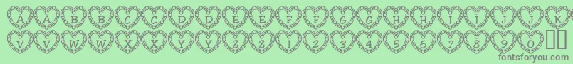 Fonte 101HeartDeco – fontes cinzas em um fundo verde