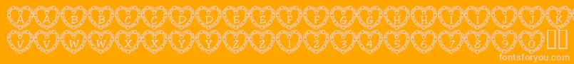 101HeartDeco-Schriftart – Rosa Schriften auf orangefarbenem Hintergrund