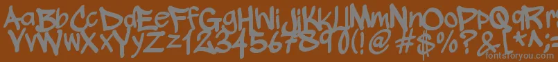 WickhopHandwriting-fontti – harmaat kirjasimet ruskealla taustalla