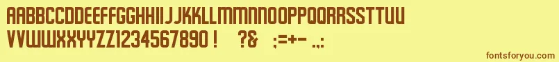 フォントSchluber – 茶色の文字が黄色の背景にあります。