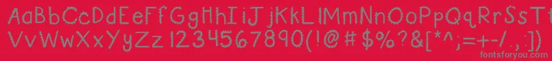 フォントKbturninggears – 赤い背景に灰色の文字