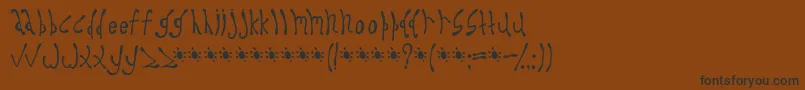 フォントDysprosium – 黒い文字が茶色の背景にあります