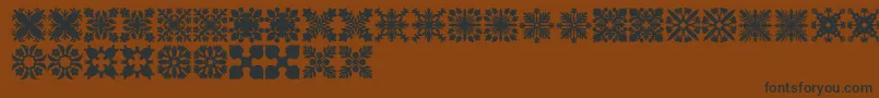 Fonte HawaiianQuilt2 – fontes pretas em um fundo marrom