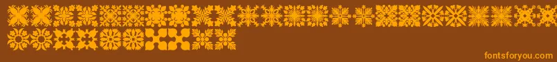 HawaiianQuilt2-fontti – oranssit fontit ruskealla taustalla