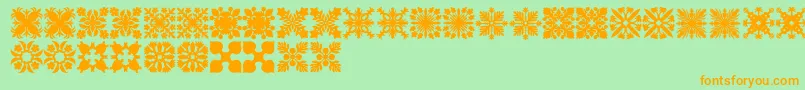 HawaiianQuilt2-Schriftart – Orangefarbene Schriften auf grünem Hintergrund