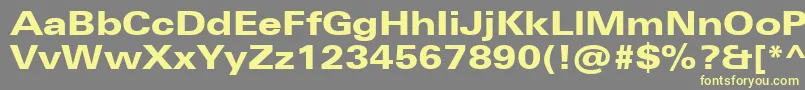 UniversNextProHeavyExtended-fontti – keltaiset fontit harmaalla taustalla