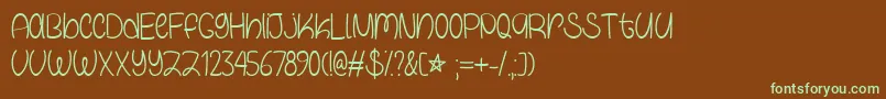 フォントGalaxyBoyTtf – 緑色の文字が茶色の背景にあります。