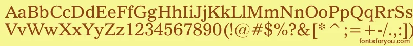 フォントQuoVadis – 茶色の文字が黄色の背景にあります。