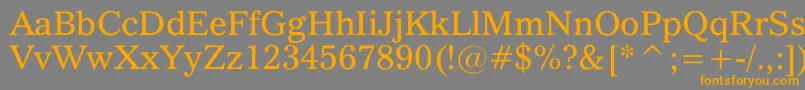 フォントQuoVadis – オレンジの文字は灰色の背景にあります。