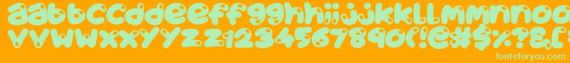 JuicyFruity-Schriftart – Grüne Schriften auf orangefarbenem Hintergrund