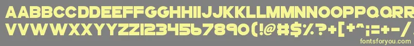 Gogoposterpunch-Schriftart – Gelbe Schriften auf grauem Hintergrund
