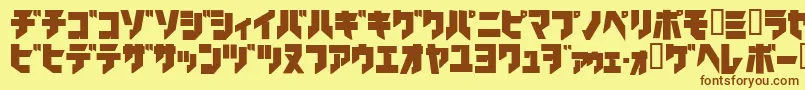 フォントIronkatakanablack – 茶色の文字が黄色の背景にあります。