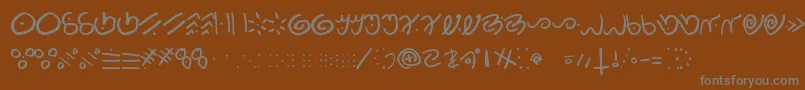 フォントKamis – 茶色の背景に灰色の文字