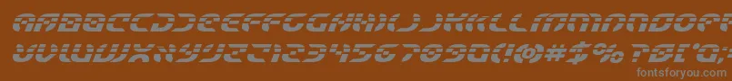 フォントStarfighterlaserboldital – 茶色の背景に灰色の文字