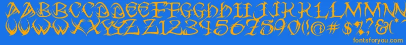 フォントTribal – オレンジ色の文字が青い背景にあります。