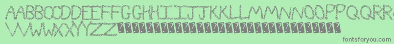 Curlyque Font – Gray Fonts on Green Background