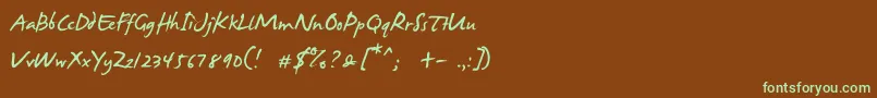 フォントJamesFajardo – 緑色の文字が茶色の背景にあります。